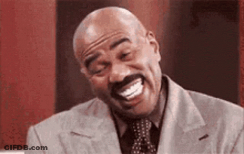 Man In Suit And Tie Laughing GIF