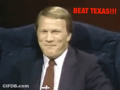 Man In Suit And Tie Laughing Beat Texas GIF