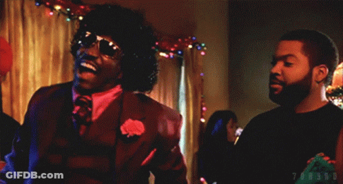 Man In Suit And Tie Laughing Beside Man In Black Shirt GIF