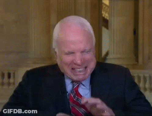Man In Suit And Tie Laughing GIF