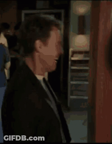 Man In Suit And Tie Laughing GIF