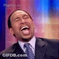 Man In Suit And Tie Laughing With Popkey.co GIF