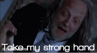 Man In Suit And Tie Laying Down Saying Take My Strong Hand GIF
