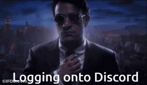 Man In Suit And Tie Logging Onto Discord GIF