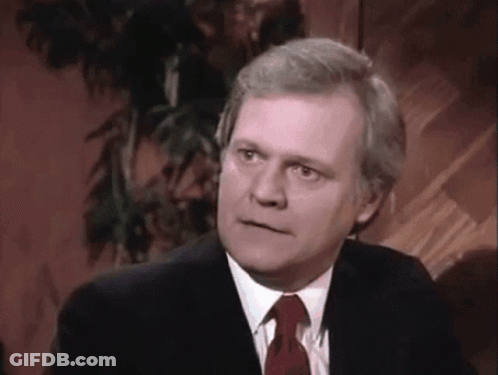 Man In Suit And Tie Looking GIF