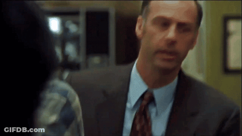 Man In Suit And Tie Looking At Another Man GIF