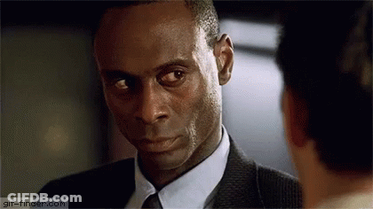 Man In Suit And Tie Looking At Another Man GIF