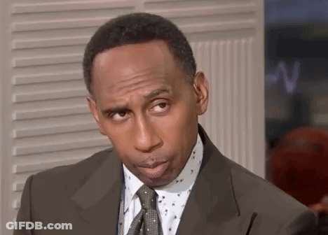 Man In Suit And Tie Looking At Camera GIF