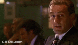 Man In Suit And Tie Looking At Camera GIF