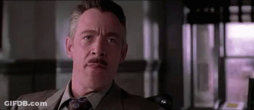 Man In Suit And Tie Looking At Camera GIF