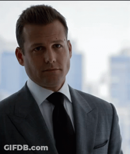 Man In Suit And Tie Looking At Camera GIF