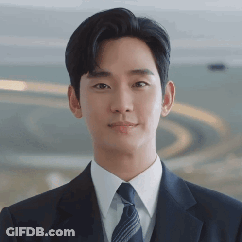 Man In Suit And Tie Looking At Camera GIF