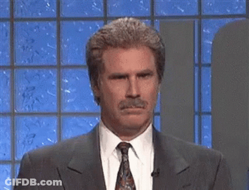 Man In Suit And Tie Looking At Camera GIF