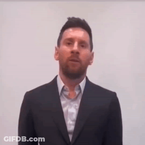 Man In Suit And Tie Looking At Camera GIF
