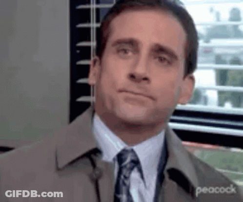 Man In Suit And Tie Looking At Camera GIF