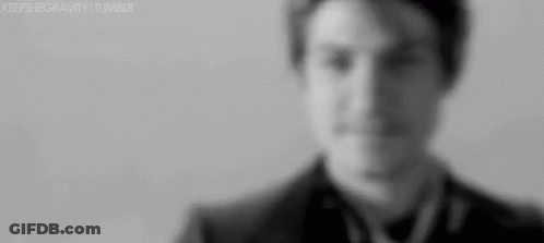 Man In Suit And Tie Looking At Camera GIF
