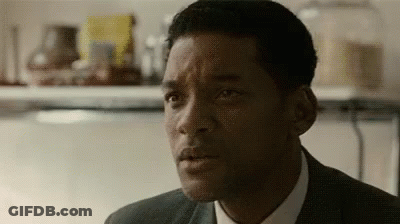 Man In Suit And Tie Looking At Camera Close Up GIF
