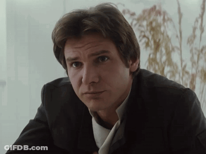 Man In Suit And Tie Looking At Camera GIF
