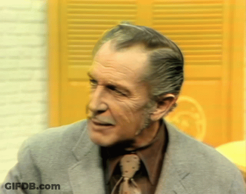 Man In Suit And Tie Looking At Camera GIF