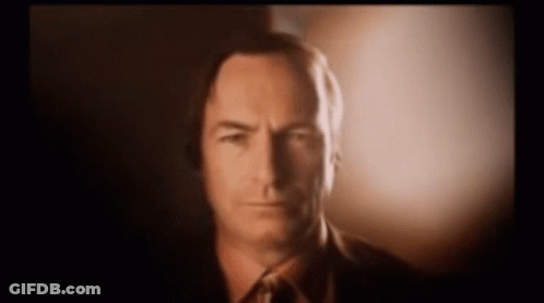 Man In Suit And Tie Looking At Camera GIF