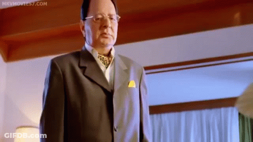 Man In Suit And Tie Looking At Camera GIF