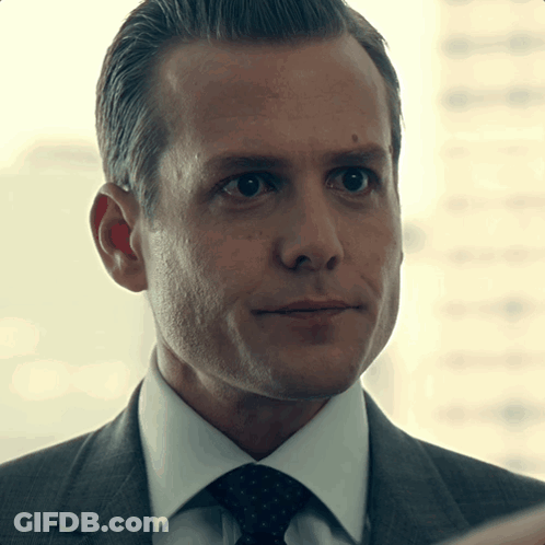 Man In Suit And Tie Looking At Camera GIF