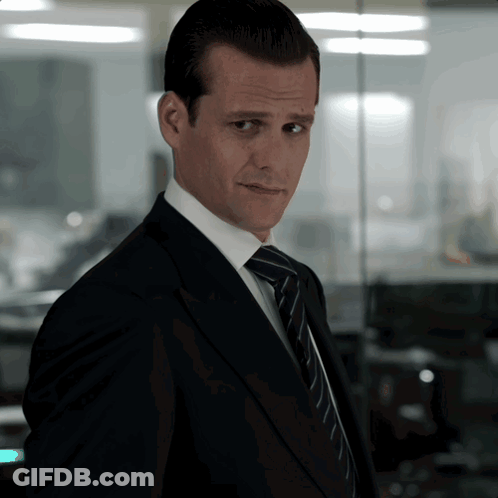 Man In Suit And Tie Looking At Camera GIF