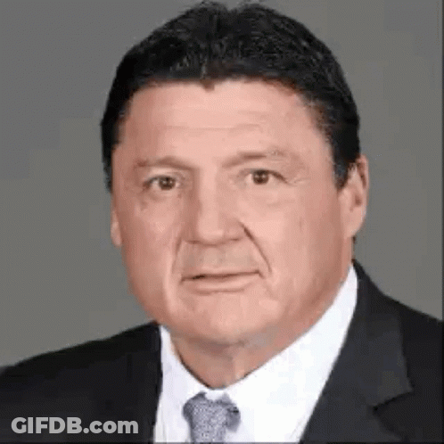 Man In Suit And Tie Looking At Camera GIF