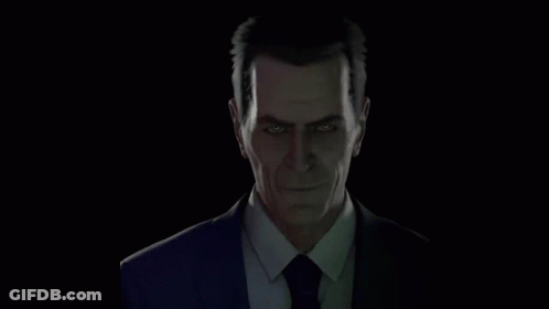 Man In Suit And Tie Looking At Camera GIF
