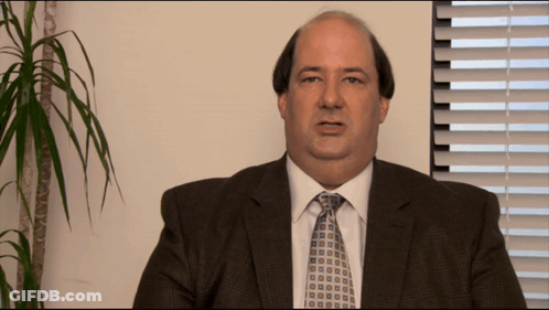 Man In Suit And Tie Looking At Camera GIF