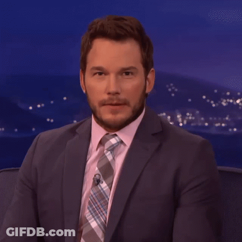 Man In Suit And Tie Looking At Camera GIF