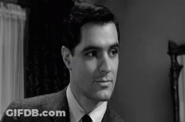 Man In Suit And Tie Looking At Camera GIF
