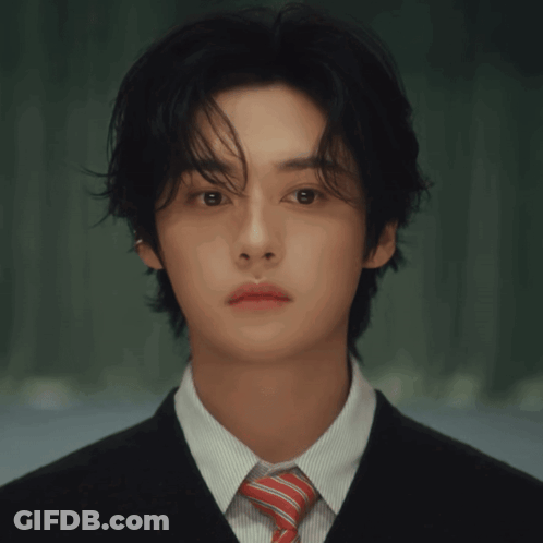 Man In Suit And Tie Looking At Camera GIF