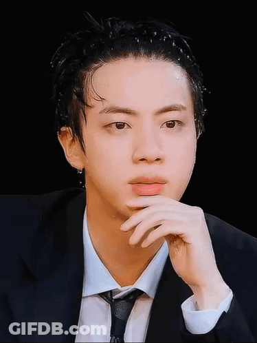 Man In Suit And Tie Looking At Camera GIF