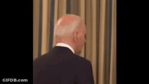 Man In Suit And Tie Looking At Camera GIF