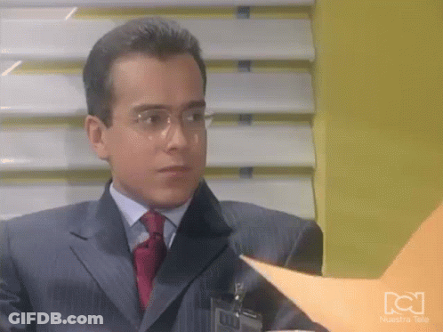 Man In Suit And Tie Looking At Paper GIF