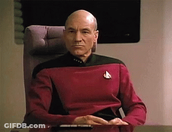 Man In Suit And Tie Looking At Something GIF