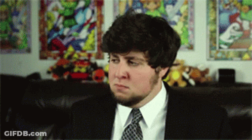 Man In Suit And Tie Looking At Something GIF