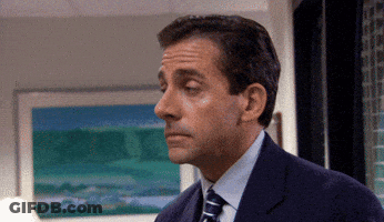 Man In Suit And Tie Looking At Something GIF