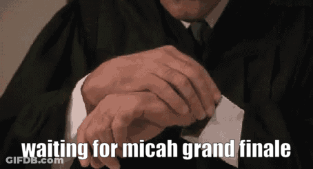 Man In Suit And Tie Looking At Watch Saying Waiting For Micah Grand Finale GIF