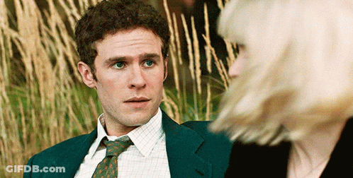 Man In Suit And Tie Looking At Woman GIF