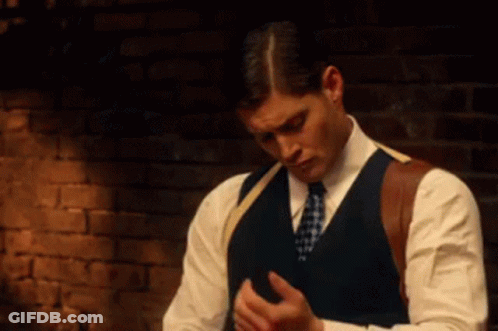 Man In Suit And Tie Looking Down GIF