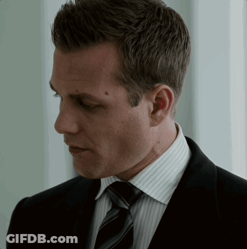 Man In Suit And Tie Looking Down GIF
