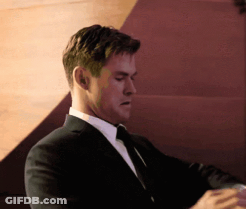 Man In Suit And Tie Looking Down GIF
