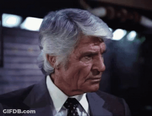 Man In Suit And Tie Looking Down GIF