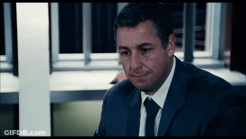 Man In Suit And Tie Looking Down GIF