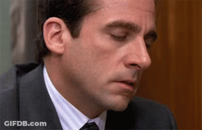 Man In Suit And Tie Looking Down GIF