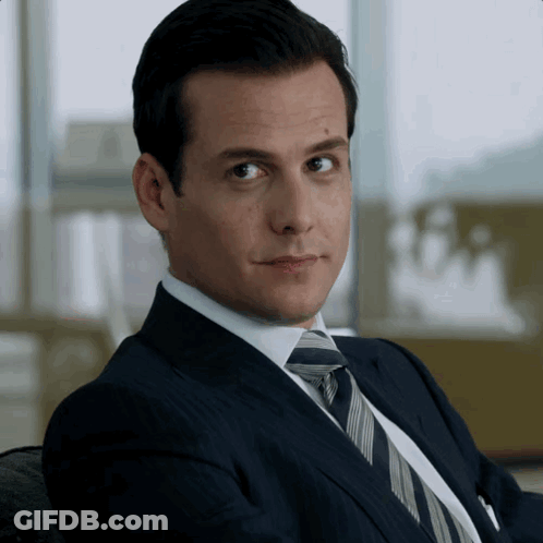 Man In Suit And Tie Looking GIF