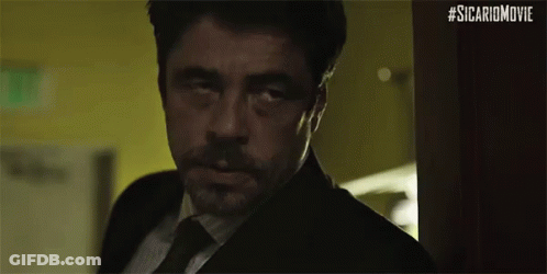 Man In Suit And Tie Looking In Doorway GIF