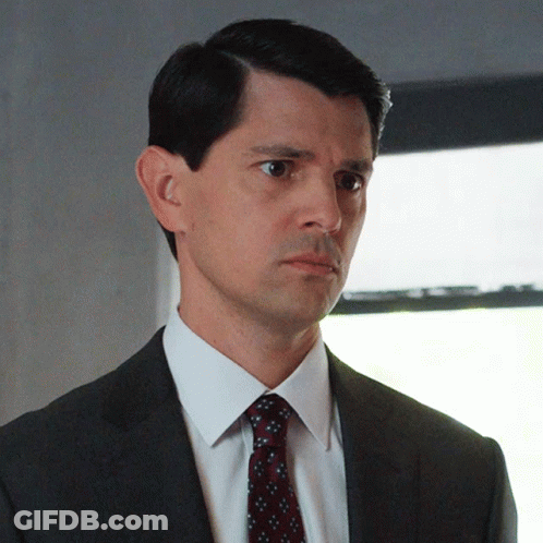 Man In Suit And Tie Looking Left GIF